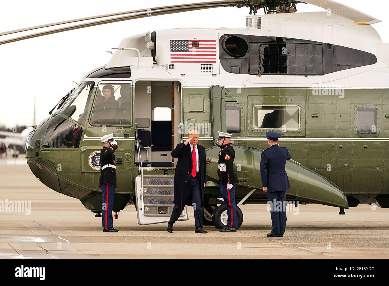 President Donald Trump disembarks Marine One and is met by U.S. Air Force Col. D.W. Schmidt Commander of the 89th Airlift Wing at Joint Base Andrews Md. Friday Feb. 7 2020 prior to boarding Air Force One for his trip to Charlotte N.C. Stock Photo