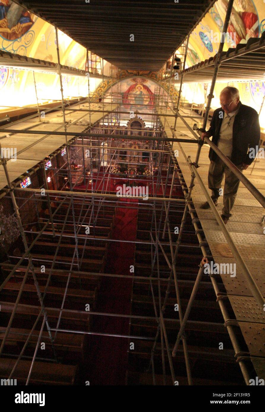 George Gianopulos, chairman of the St. George Greek Orthodox Church  iconography project in Frenso, California, looks down into the church's  sanctuary from a myriad of scaffoldings used by Russian iconographer Valery  Butyrsky