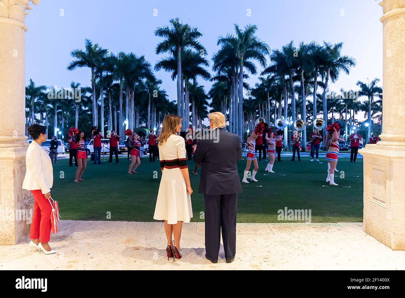 President Donald Trump and First Lady Melania Trump are entertained by members of the Florida Atlantic University marching band Sunday evening Feb. 2 2020 outside the Trump International Golf Club in West Palm Beach Fla. prior to attending a Super Bowl party. Stock Photo