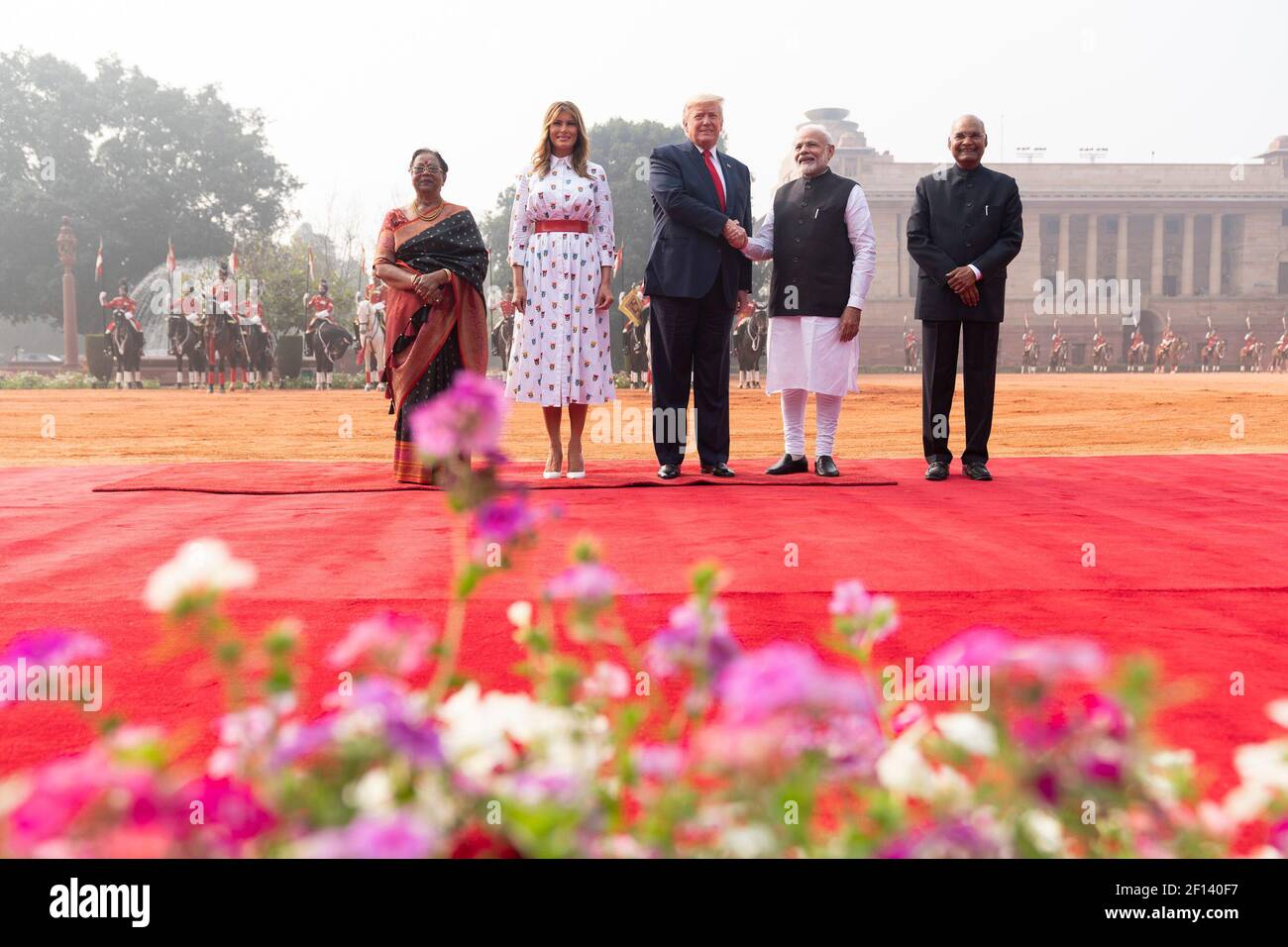 President Donald Trump shakes hands with Indian Prime Minister Narendra Modi during a welcome ceremony at Rashtrapati Bhavan the Presidential Palace Tuesday Feb. 25 2020 in New Delhi India. From left Mrs. Savita Kovind the wife of the Indian President Ram Nath Kovind First Lady Melania Trump and Indian President Ram Nath Kovind. Stock Photo