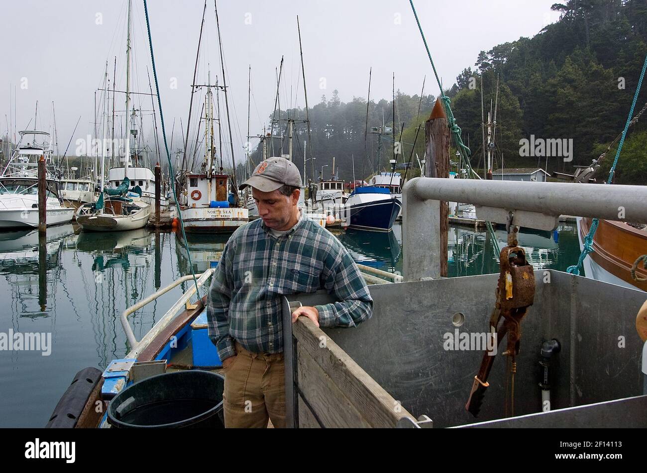 Commercial salmon fisherman Ben Platt stands on his boat the 'Kay Bee