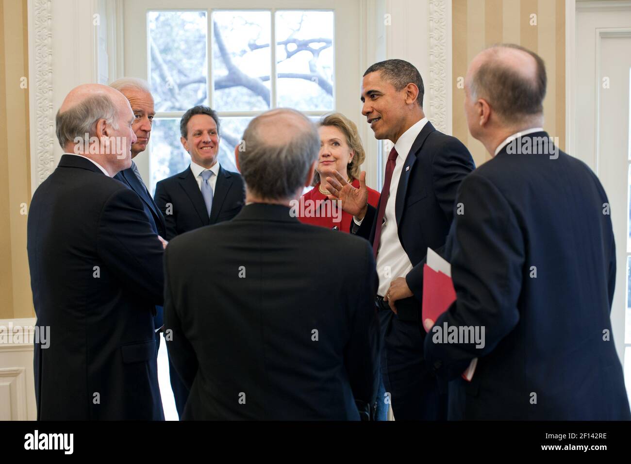 President Barack Obama and Vice President Joe Biden talk with senior administration officials in the Oval Office, Jan. 19, 2011. Pictured from left are: Bill Daley, Timothy F. Geithner, Jeffrey Bader, Hillary Rodham Clinton, and Tom Donilon Stock Photo