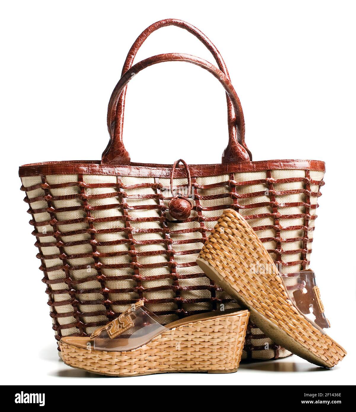 This functional tote from Nancy Gonzalez features woven caiman crocodile  over jute. The suede-lined interior holds a deep zippered pocket plus a  pocket for your cell phone, $1,485, Neiman Marcus. The Tory