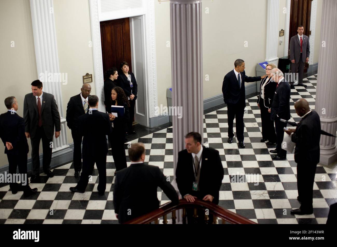 President Barack Obama talks with Sen. Claire McCaskill (D-Mo.) and Vice President Joe Biden following the Tax Deliquency Memorandum signing in the Eisenhower Executive Office Building of the White House Jan. 20 2010. Stock Photo