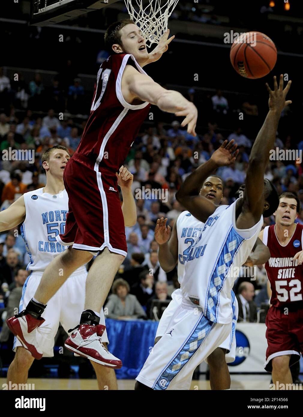 Washington State's Aron Baynes (11) loses control of the ball on a