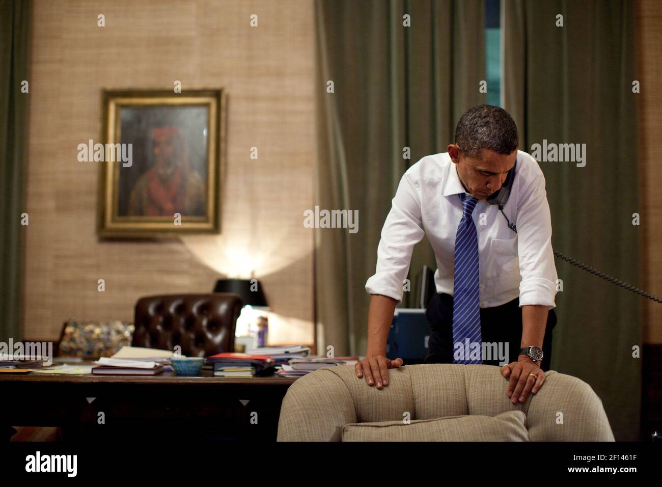 President Barack Obama talks on the phone in the Treaty Room Office in the Residence of the White House, Nov. 23, 2010 Stock Photo