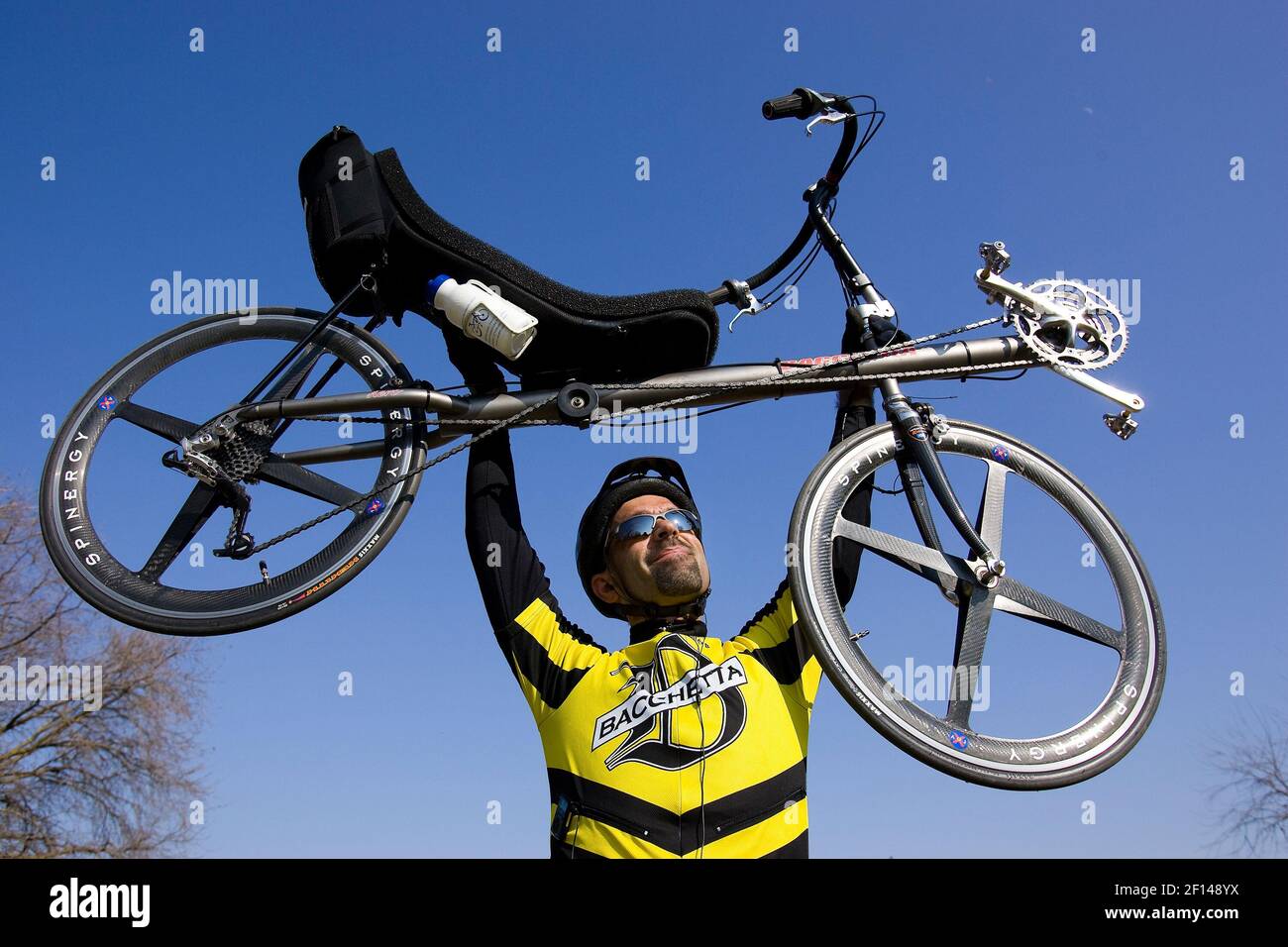 Gary Souza holds his lightweight recumbent bike on the American River  Parkway BikeTrail in Sacramento, California. A growing number of cyclists  who are switching to recumbent bikes that are easier on the