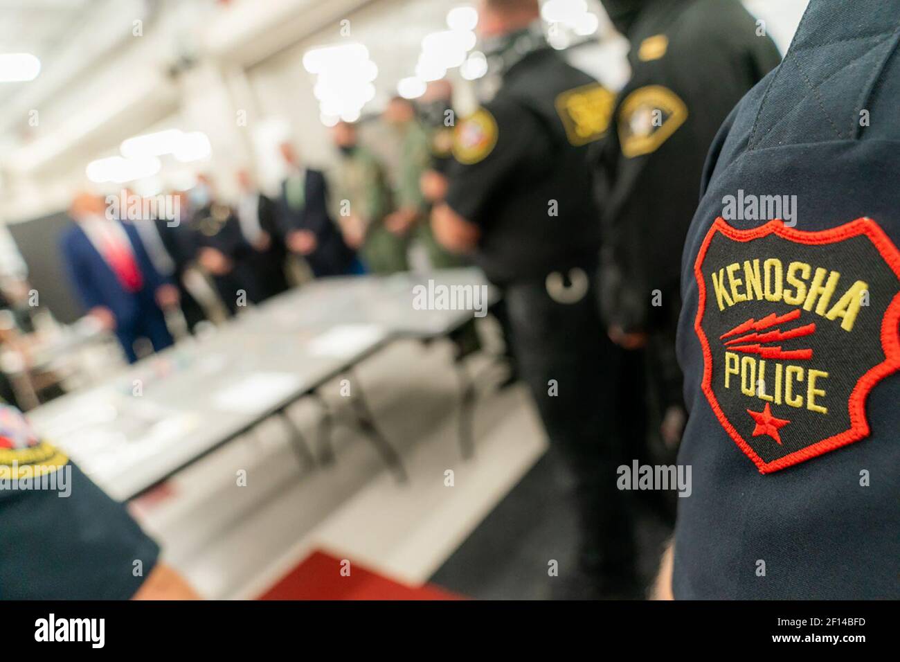 President Donald Trump joined by Rep. Bryan Steil R- Wis. and Senator Ron Johnson. R-Wis. addresses law enforcement and National Guard personnel during a tour of an emergency operation center Tuesday Sept. 1 2020 at Mary D. Bradford High School in Kenosha Wis. Stock Photo