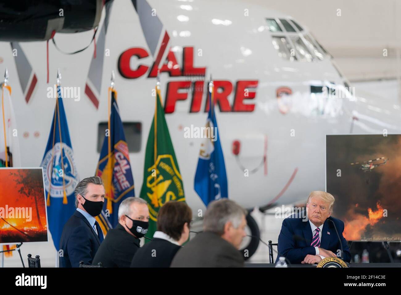 President Donald Trump participates in a briefing on wildfires with California Gov. Gavin Newsome and local and federal fire and emergency authorities Monday Sept. 14 2020 at the Cal Fire Hangar at the Sacramento McClelland Airport in McClelland Park Calif. Stock Photo