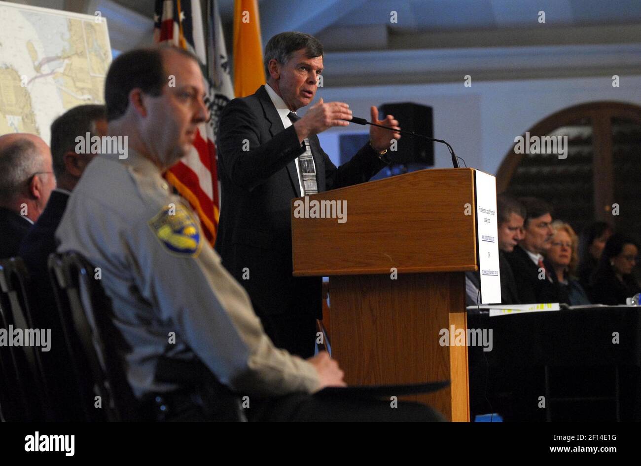 United States Coast Guard Retired (USCGR) Admiral Carlton Moore, center, addresses the press at the Nimitz Conference Center on Treasure Island in San Francisco, California, Monday, January 28, 2008. Moore is chairman of the Incident Specific Preparedness Review team, seated at the tables on the right, of the Cosco Busan oil spill. In the foreground is Steve Edinger, assistant chief, California Department of Fish and Game. (Photo by Joanna Jhanda/Contra Costa Times/MCT/Sipa USA) Stock Photo