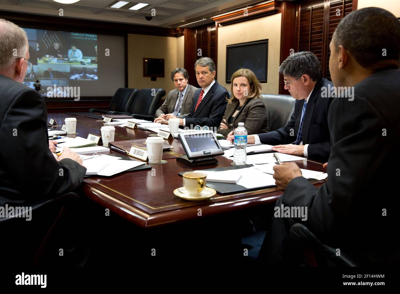 President Barack Obama receives an update on the ongoing response to Hurricane Sandy, in the Situation Room of the White House, Oct. 30, 2012. Pictured, from left, are: John Brennan, Anthony Blinken, David Agnew, Alyssa Mastromonaco, and Jack Lew. Stock Photo