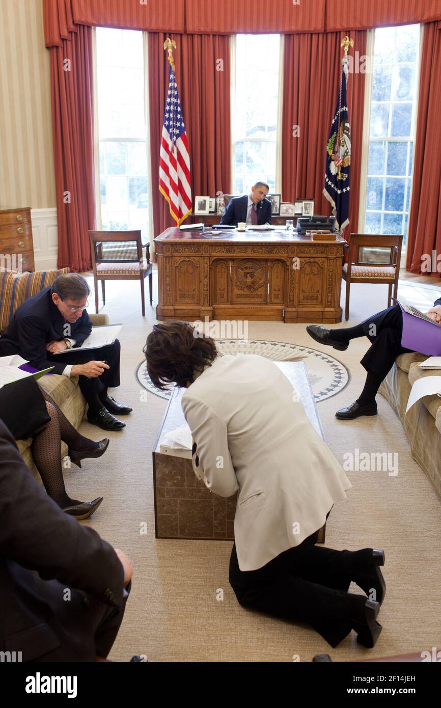 Members of President Barack Obama's national security team listen as he talks on the phone with Field Marshal Mohamed Hussein Tantawi of Egypt in the Oval Office, Jan. 20, 2012. From left are; Larry Pfeiffer, Caroline Atkinson, Steve Simon, Brooke Anderson and Tom Donilon Stock Photo