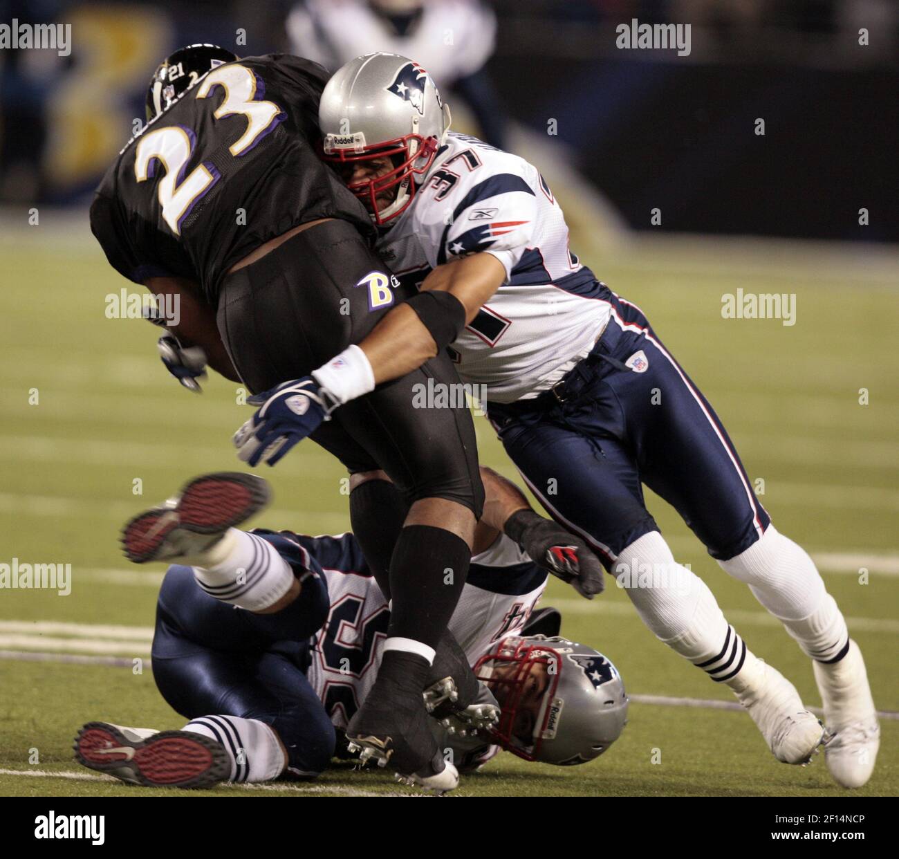 New England Patriots' Rodney Harrison (37) celebrates his fourth quarter  interception with teammate Randy Moss during New England's 31-20 win over  the Jacksonville Jaguars in a playoff football game at Gillette Stadium