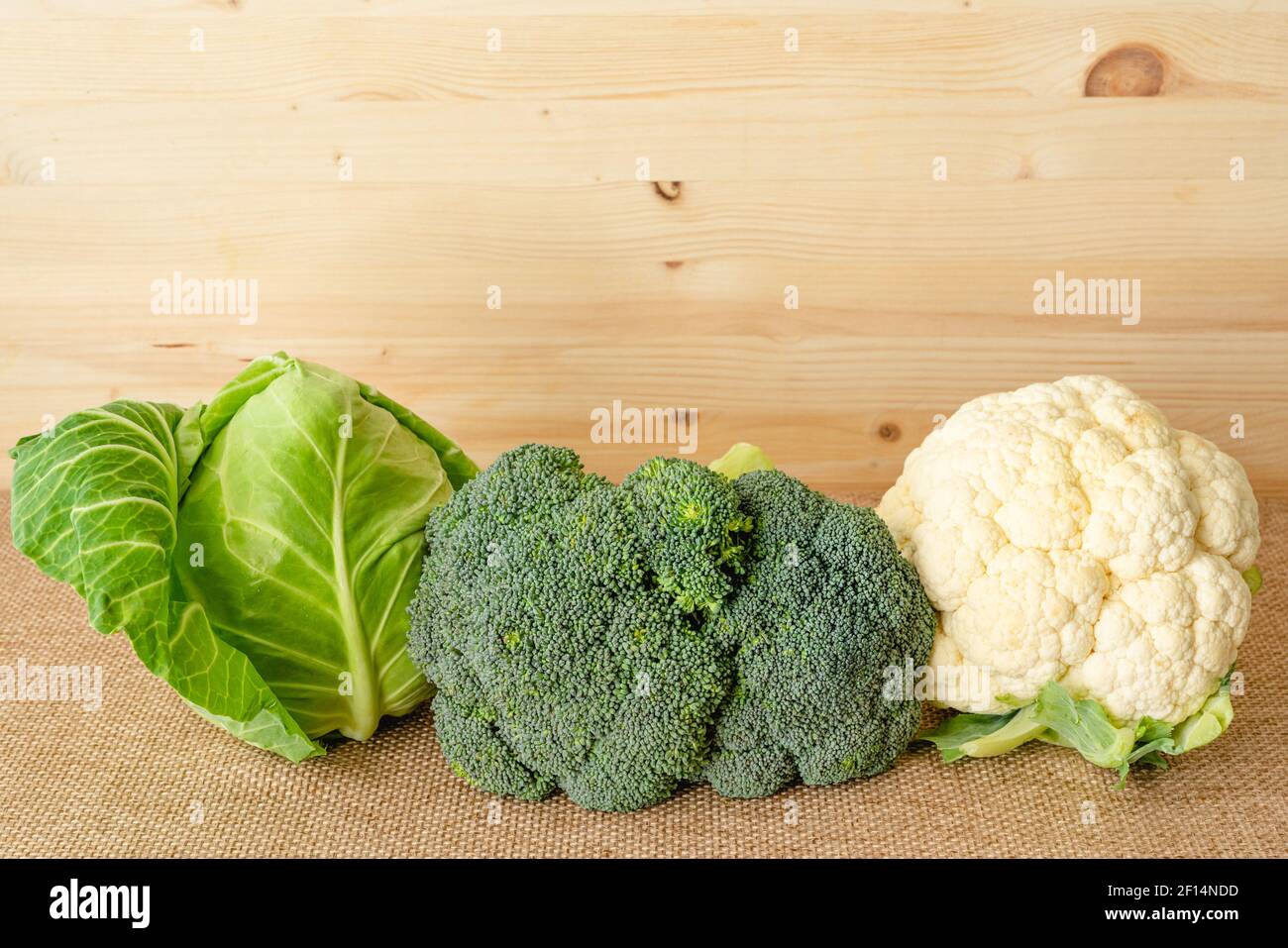 Green Cabbage Broccoli And Cauliflower Close Up On Rustic Background Green Cabbage Broccoli And Cauliflower Close Up On Rustic Background