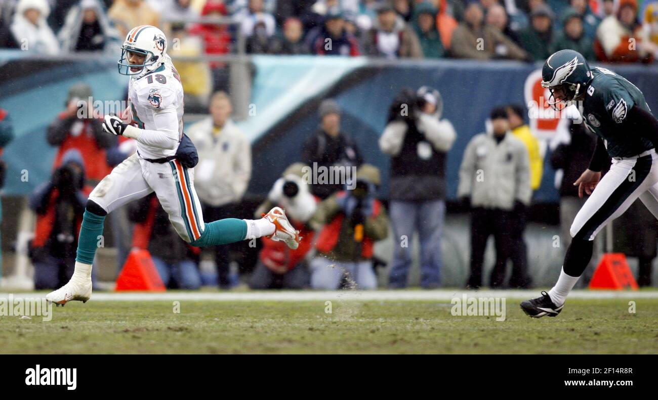 Miami Dolphins wide receiver Ted Ginn Jr. returns a kick for a