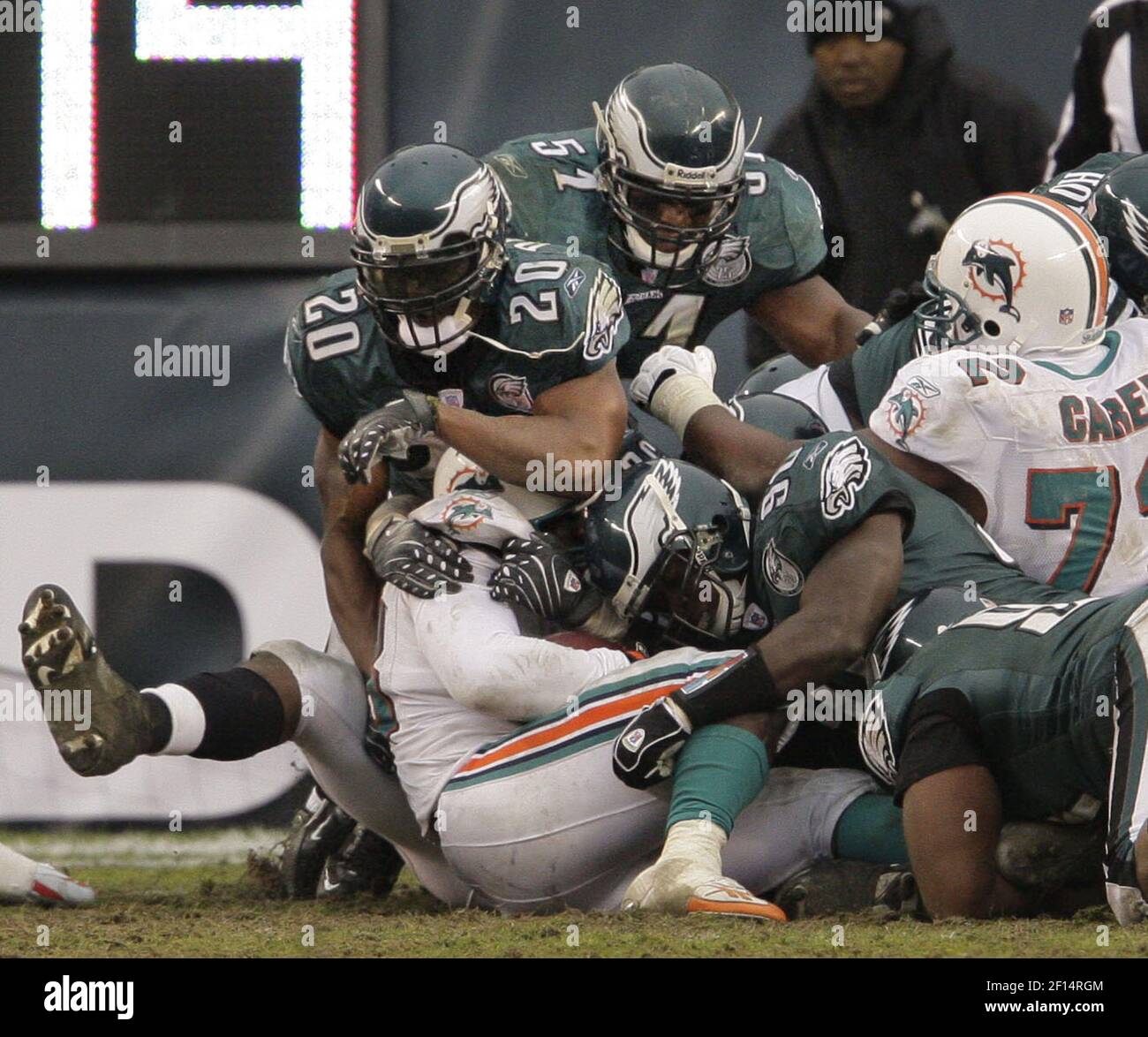 Philadelphia Eagles Trent Cole (58), Brian Dawkins (20) and a host of other  Eagles stop Miami Dolphins Jesse Chatman on a first down at the goal line  in fourth quarter action. The