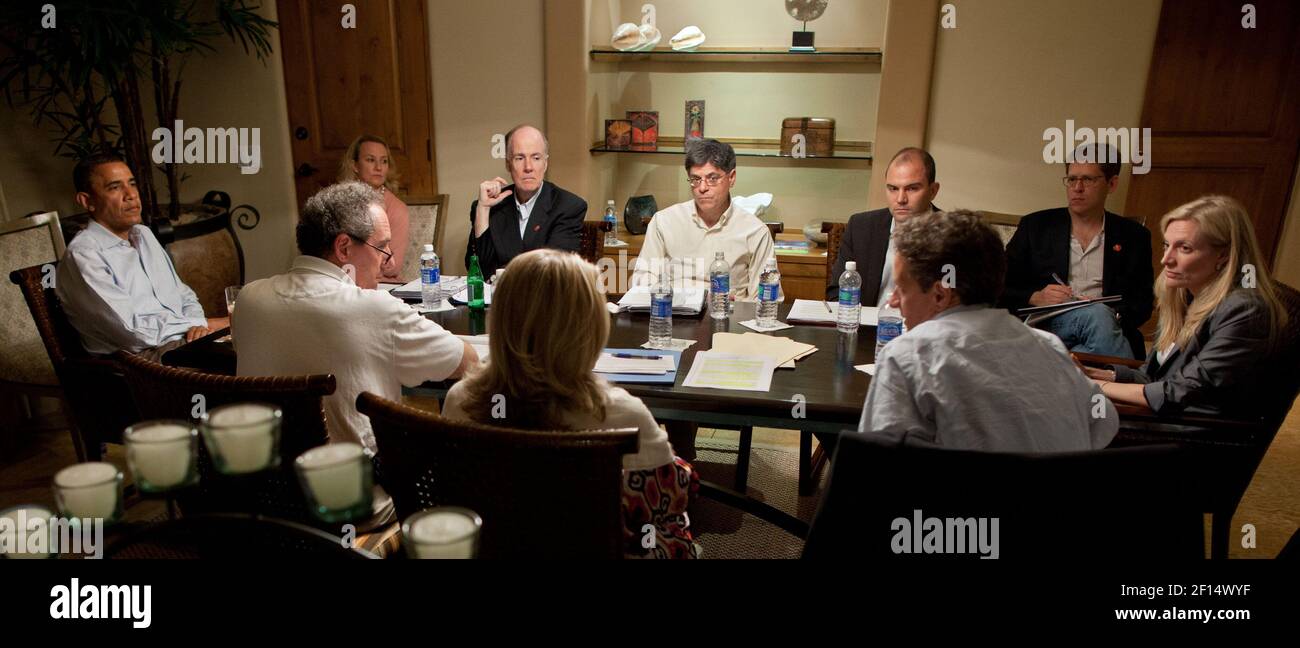 President Barack Obama is briefed by senior advisors at the Esperanza Resort in San Jose Del Cabo, Mexico, on the eve of the G20 Summit, June 17, 2012. Clockwise from the President, are: Alice Wells, Tom Donilon; Jack Lew; Ben Rhodes, Jay Carney; Lael Brainard, Tim Geithner; Hillary Rodham Clinton; and Mike Froman Stock Photo