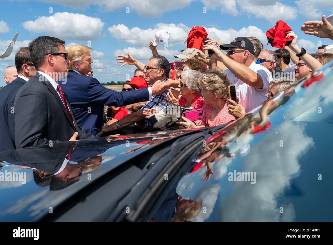 President Donald Trump shakes hands and poses for photos with supporters Thursday Oct. 3 2019 upon his arrival to Ocala International Airport in Ocala Fla. en route to visit The Villages FL. Stock Photo
