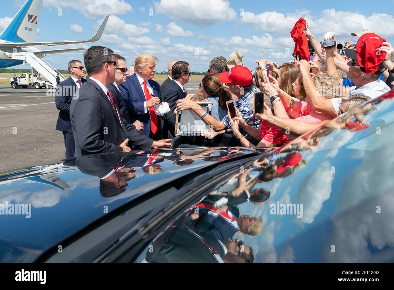 President Donald Trump shakes hands and poses for photos with supporters Thursday Oct. 3 2019 upon his arrival to Ocala International Airport in Ocala Fla. en route to visit The Villages FL. Stock Photo