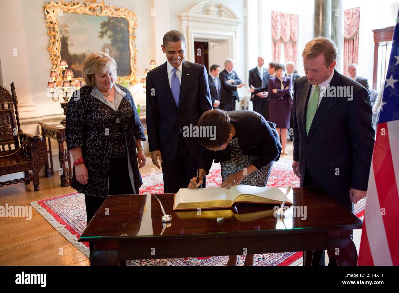 President Barack Obama and First Lady Michelle Obama sign the guestbook during their visit to Farmleigh in Dublin, Ireland, May 23, 2011 Stock Photo