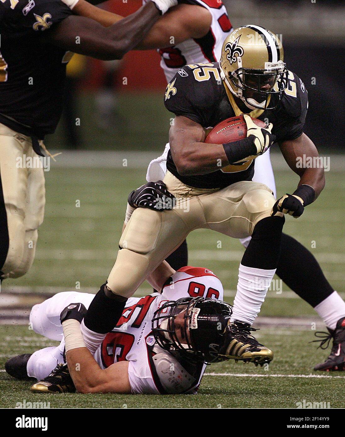 Atlanta Falcons linebacker Keith Brooking manages to tackle New Orleans  Saints running back Reggie Bush during first quarter action. The Saints  defeated the Falcons 22-16 at the Louisiana Superdome in New Orleans,