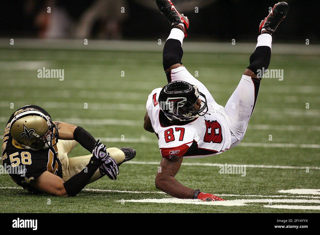 Atlanta Falcons wide receiver Joe Horn is sent flying on a hard tackle by  New Orleans Saints linebacker Scott Shanle in fourth quarter action. The  Saints defeated the Falcons 22-16 at the