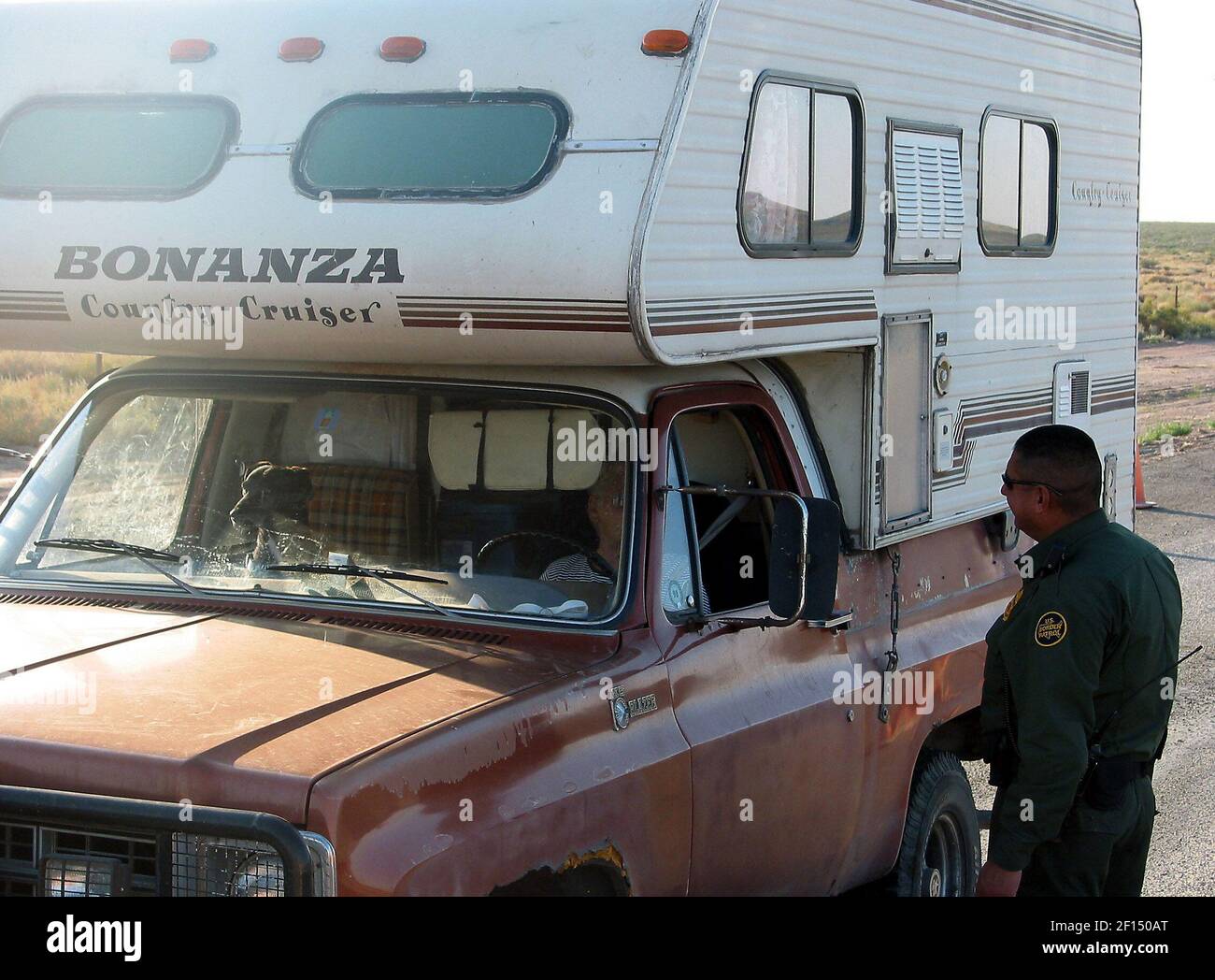 A Border Patrol agent checks a camper earlier in the morning at a ...