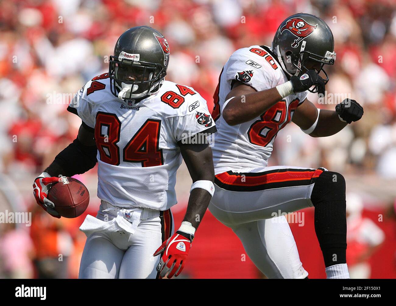 Tampa Bay Buccaneers receivers Michael Clayton (L) and John Gilmore watch  the scoreboard late in the fourth quarter against the Denver Broncos at  Invesco Field at Mile High in Denver on October