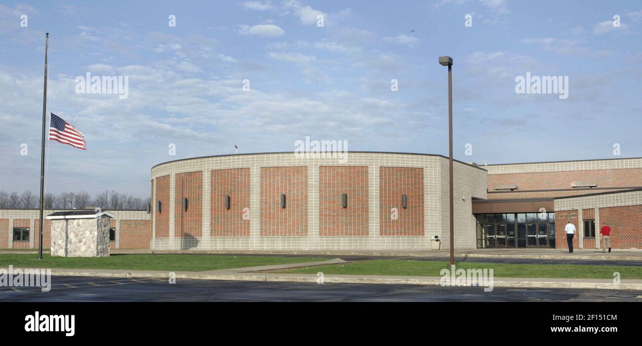 Teachers and counselors arrive for a school meeting at Crandon High
