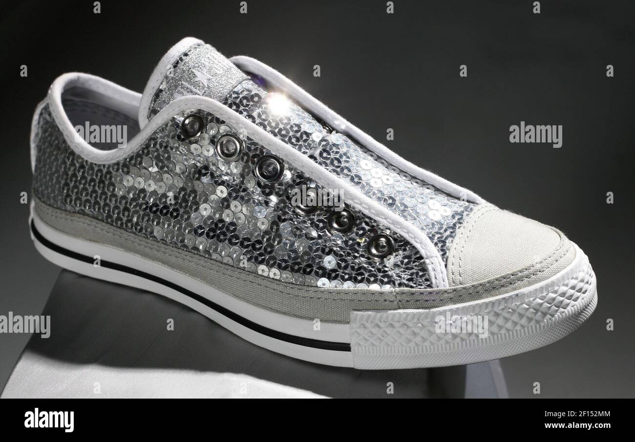 The sequin sneaker. This shoe is a little silly, true, but it combines two  of our favorite things: The comfort of classic but laceless Converse All- Stars and the girly-girl shine of silver.