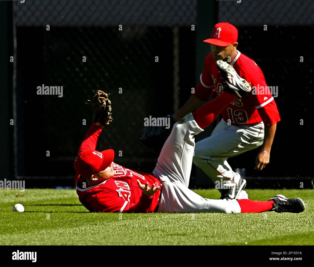 Los Angeles Angels center fielder Reggie Willits lies on the ground as ...