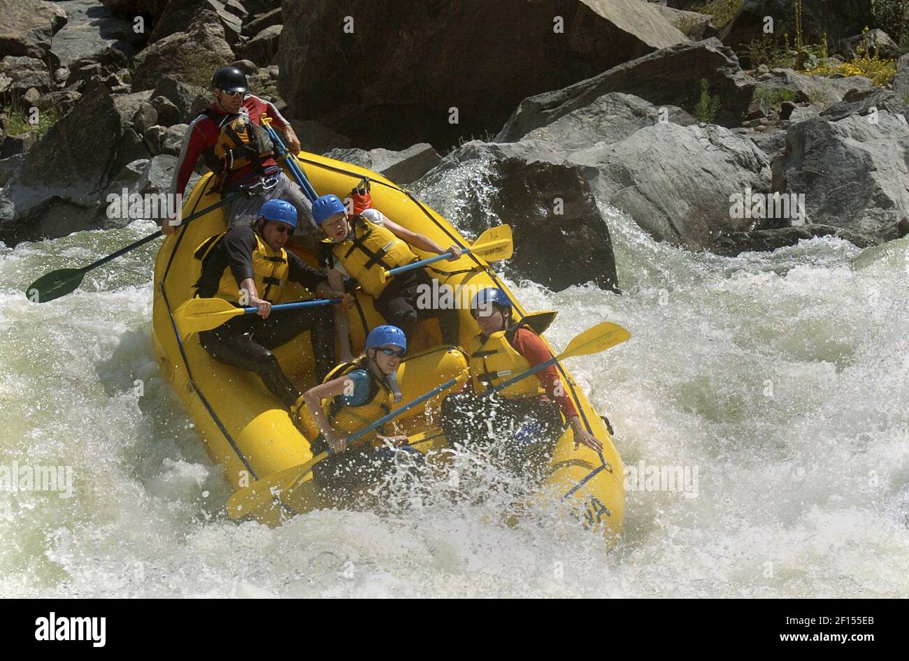 A raft led by guide, Keith Kirchner nose dives into Tunnel Falls, one