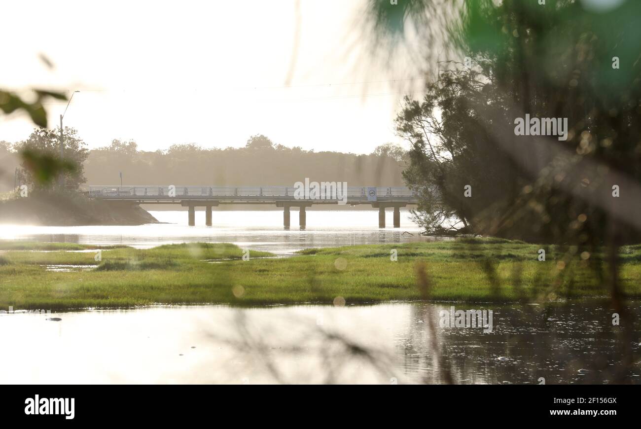 Nice view to the main bridge on ocean dr at Lake Cathie, Mid North Coast NSW. View over lake through trees to the coast. Lake Cathie is a popular fami Stock Photo