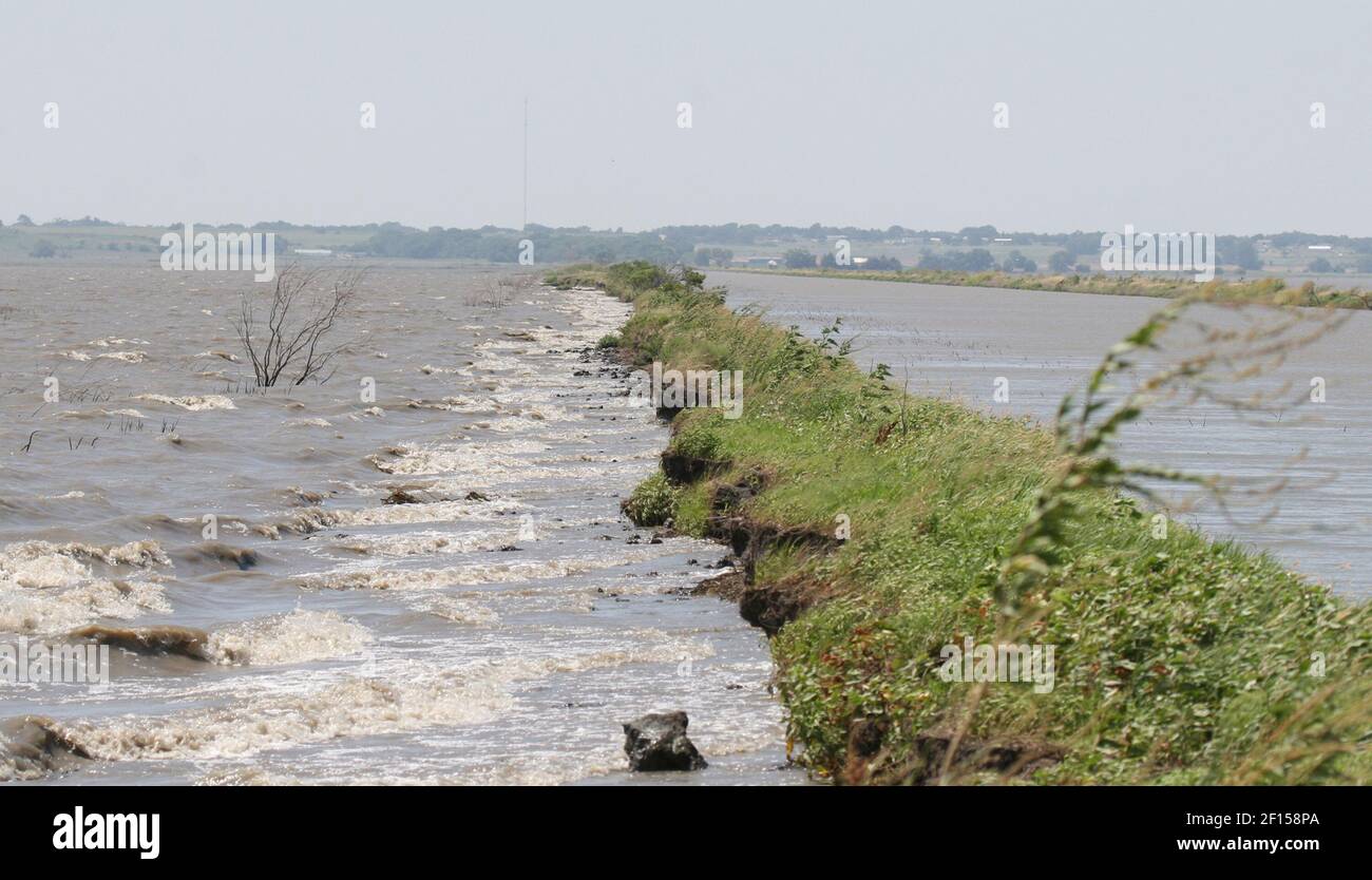 Once 50 feet wide, this dike between a pool and the inlet canal has