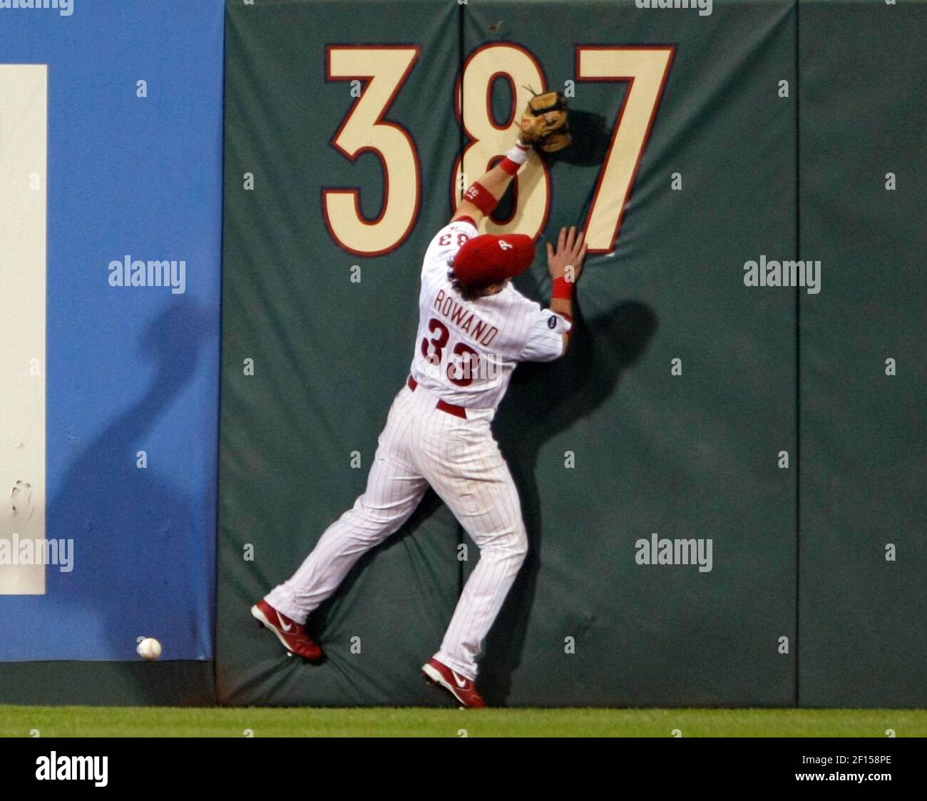 Philadelphia Phillies centerfielder Aaron Rowand hits the wall