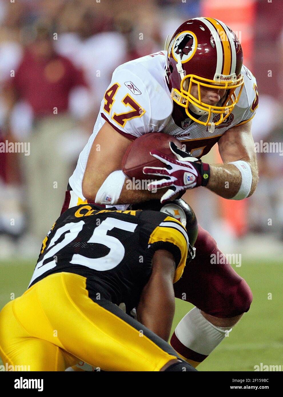 Washington Redskins Chris Cooley (47) is hit hard by Pittsburgh Steelers  Ryan Clark (25) during their preseason football game played at FedEx Field  in Landover, MD, Saturday, August 18, 2007. (Photo by
