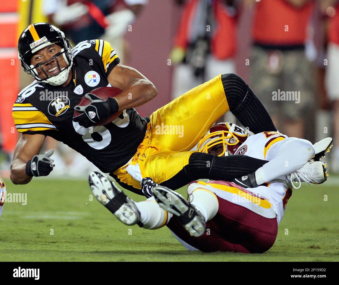 Pittsburgh Steelers Hines Ward (86) is tackled by Washington Redskins Shawn  Springs (24) during their preseason football game played at FedEx Field in  Landover, MD, Saturday, August 18, 2007. (Photo by Harry