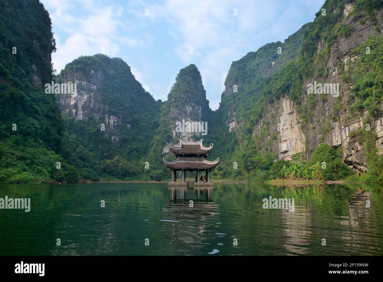 Floating temple in a lake at the  Trang An Scenic Landscape Complex, near Ninh Binh, Vietnam. Stock Photo