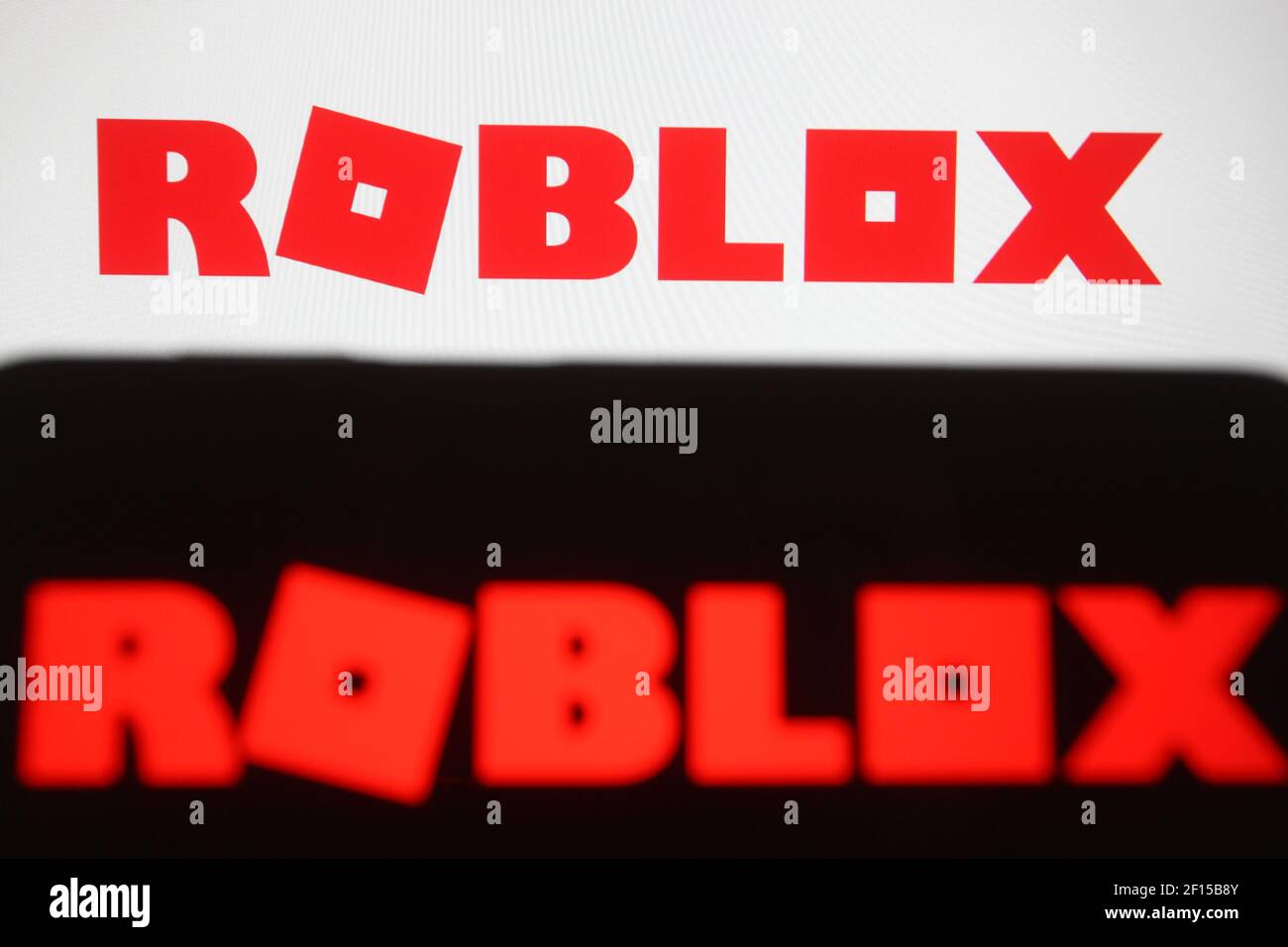 In this photo illustration the Roblox logo of an online game platform is  seen on a smartphone and a pc screen. (Photo by Pavlo Gonchar / SOPA  Images/Sipa USA Stock Photo 