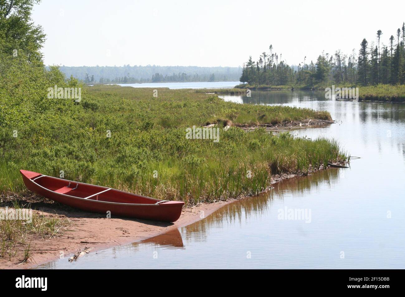 A canoe waits for paddlers on the shoreline of the lovely but sleepy