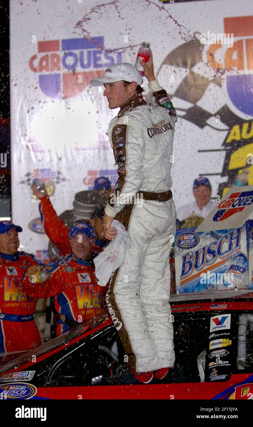 Kasey Kahne celebrates in victory lane after winning the NASCAR Busch