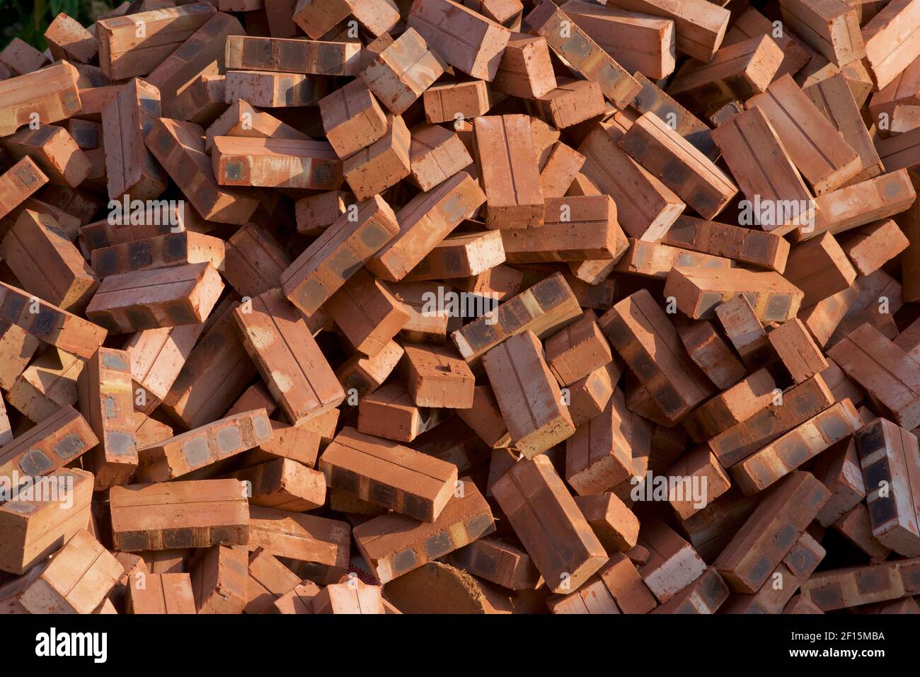 Haphazard pile of Bricks. Building materials used in construction. Rectangles Stock Photo