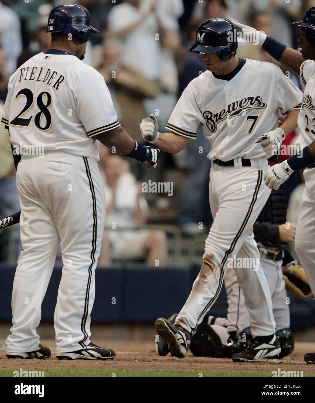 Milwaukee Brewers' J.J. Hardy, right, is congratulated by Prince Fielder  after hitting a two-run home run during the fifth inning of a baseball game  against the Pittsburgh Pirates Friday, July 4, 2008