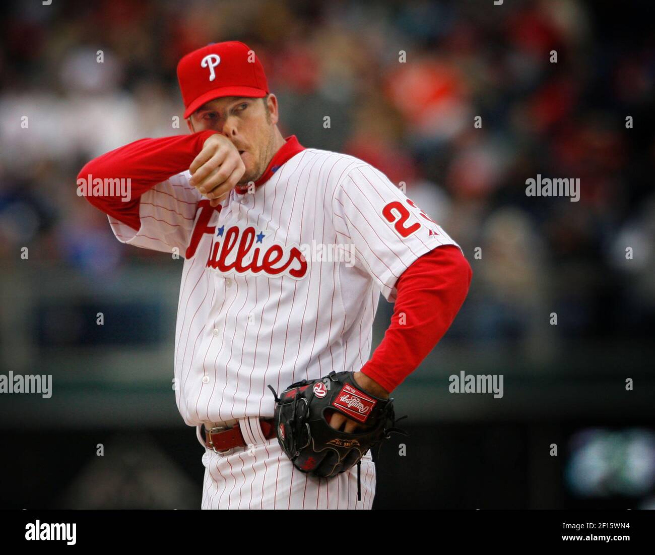 Philadelphia Phillies starting pitcher Adam Eaton wipes his nose in the  freezing cold after giving up a double to Atlanta Braves' Andrew Jones in  the fifth inning at Citizens Bank Park in
