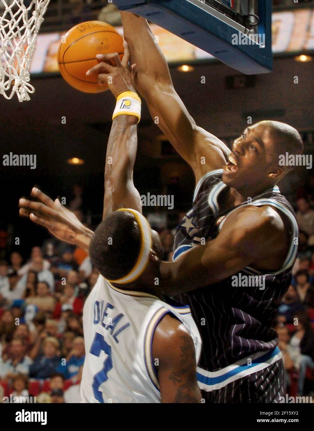 Indiana Pacers forward Jermaine O'Neal, left, blocks a shot by Orlando  Magic center Dwight Howard during the first half of their basketball game  in Orlando, Fla., on Friday, Dec. 7, 2007. (AP, image size:1014x1390