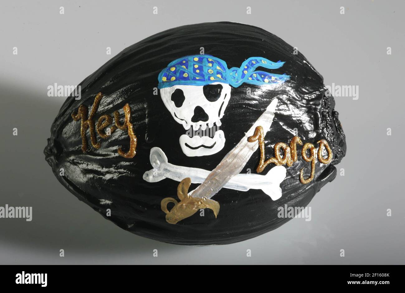This painted coconut is actually an unusual postcard that bears the ...