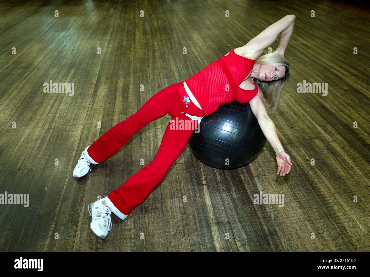 Nancy Cole demonstrates an oblique crunch using a Swiss ball. (Photo by