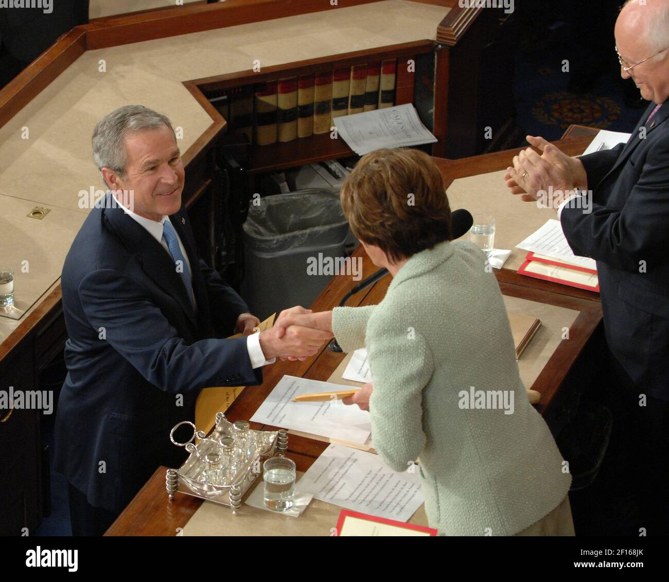 U.S. President George W. Bush shakes hands with Speaker of the House Nancy Pelosi (D-CA) as he arrives to deliver his State of the Union address to a joint session of Congress in the House of Representatives Chamber on Tuesday, January 23, 2007. (Photo by George Bridges/MCT/Sipa USA) Stock Photo