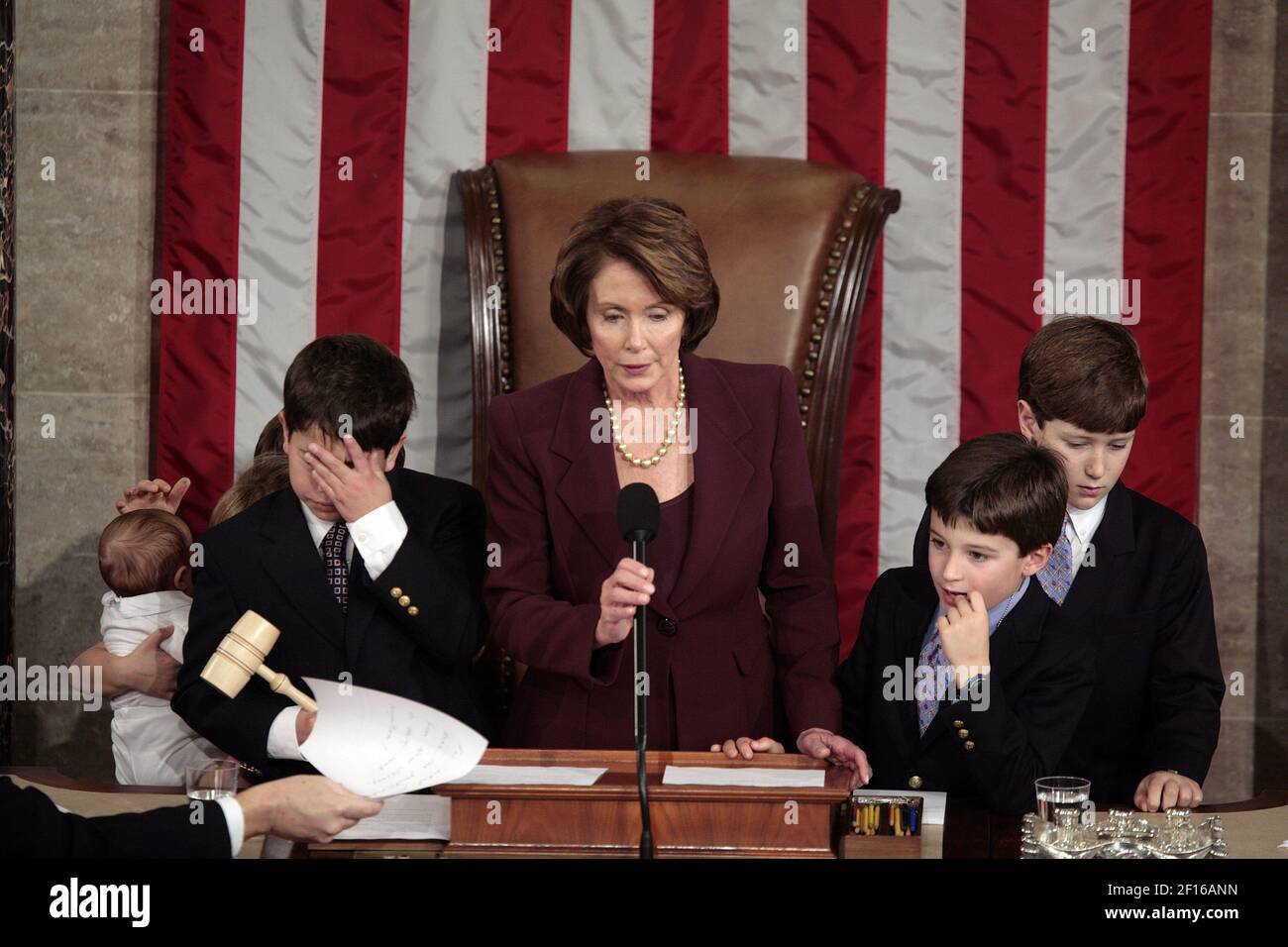 U.S. Rep. Nancy Pelosi (D-CA) is surrounded by family as she takes the podium for the first time in the position of Speaker of the House, becoming the first woman to hold that position, on the opening day of the legislative session on Thursday, January 4, 2006, in Washington, DC. (Photo by Chuck Kennedy/MCT/Sipa USA) Stock Photo