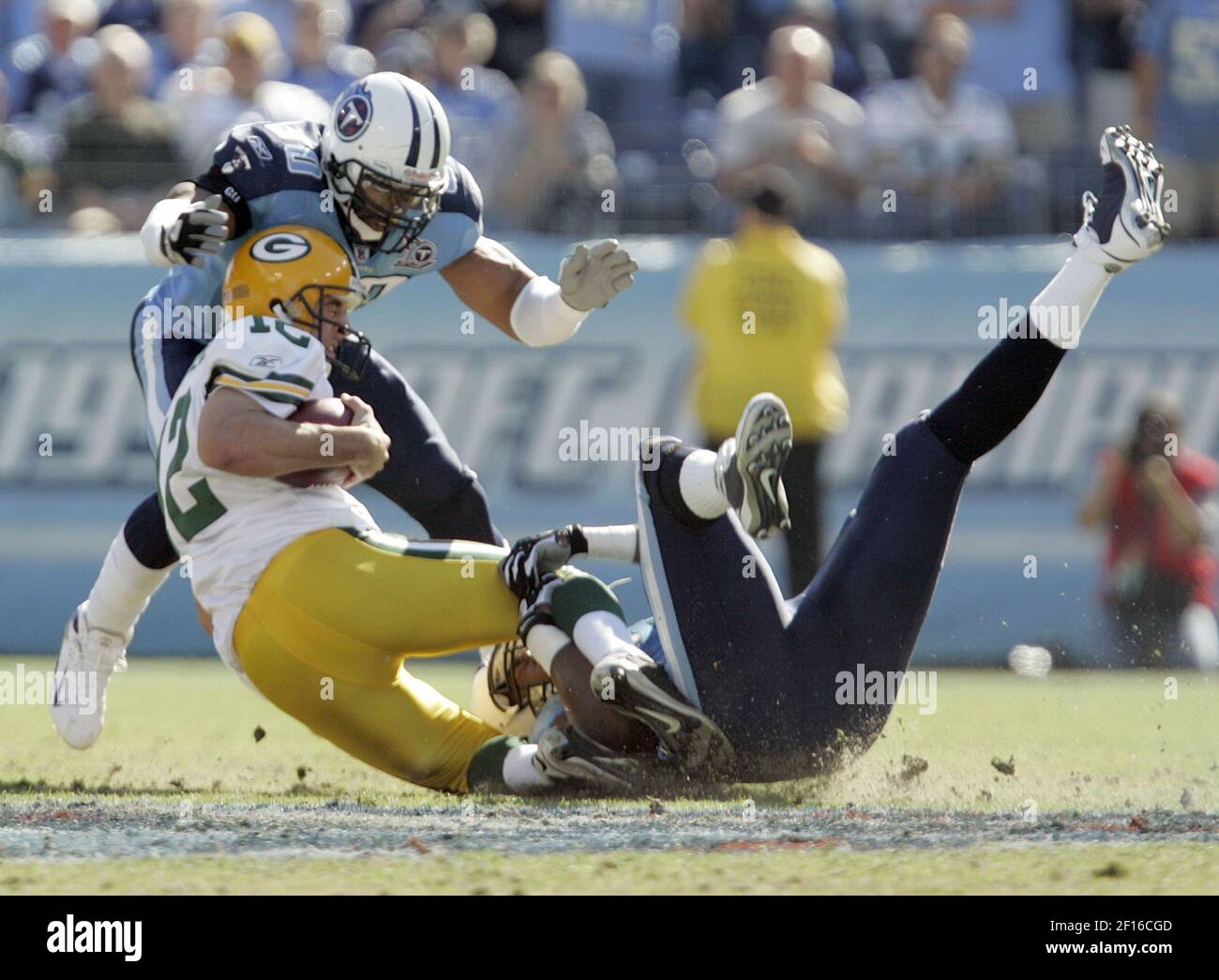 Green Bay Packers quarterback Aaron Rodgers is hit by Tennessee Titans'  Jason Jones, left, and David Thornton in the second half at LP Field in  Nashville, Tennessee, on Sunday, November 2, 2008.